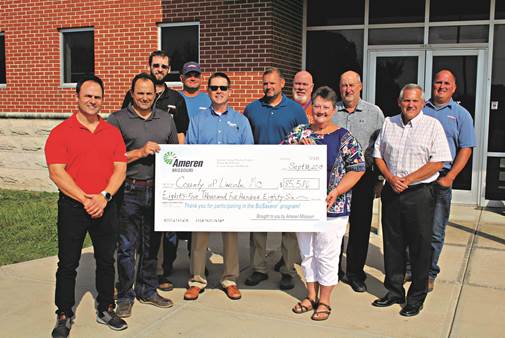 members holding ameren savings check for lincoln county justice center