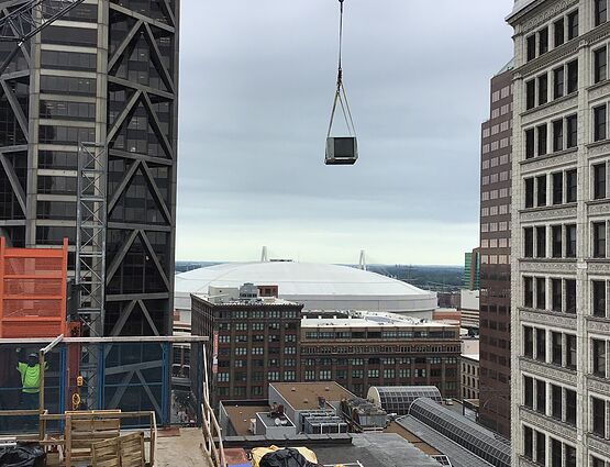 hvac system being lifted by crane