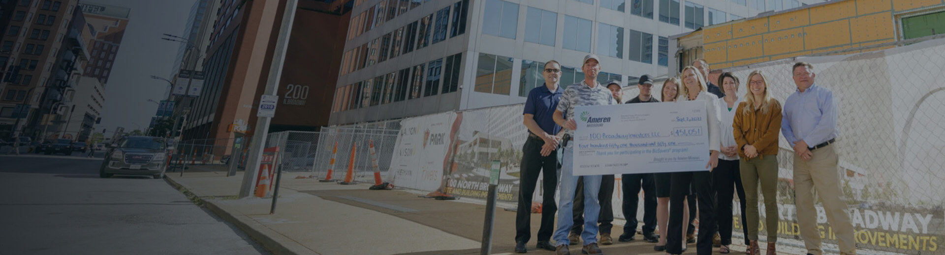 Group of Employees Holding Up Check from Ameren UE