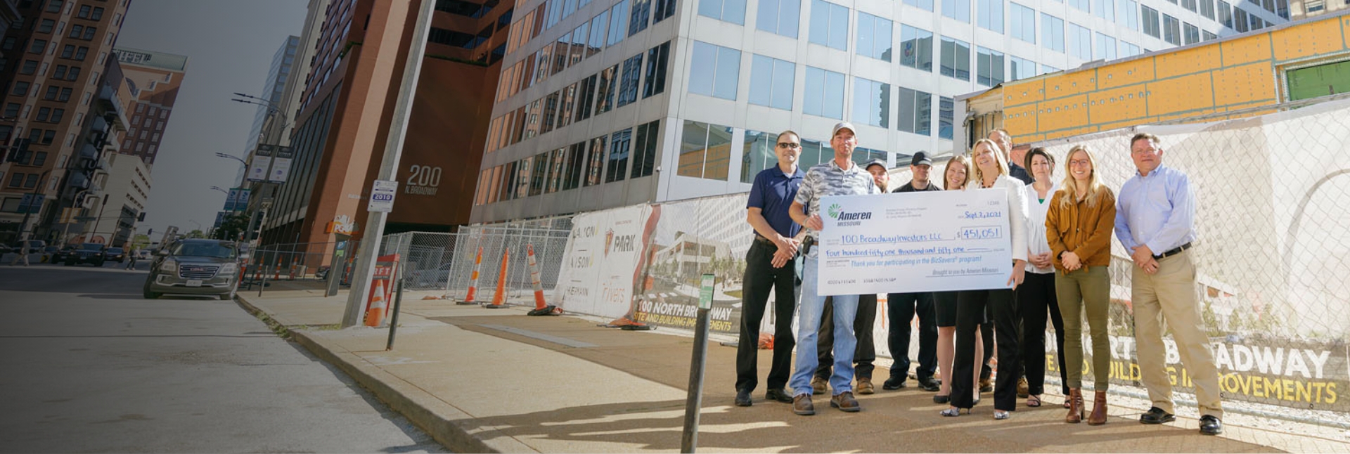 Group of Employees Holding Up Check from Ameren UE